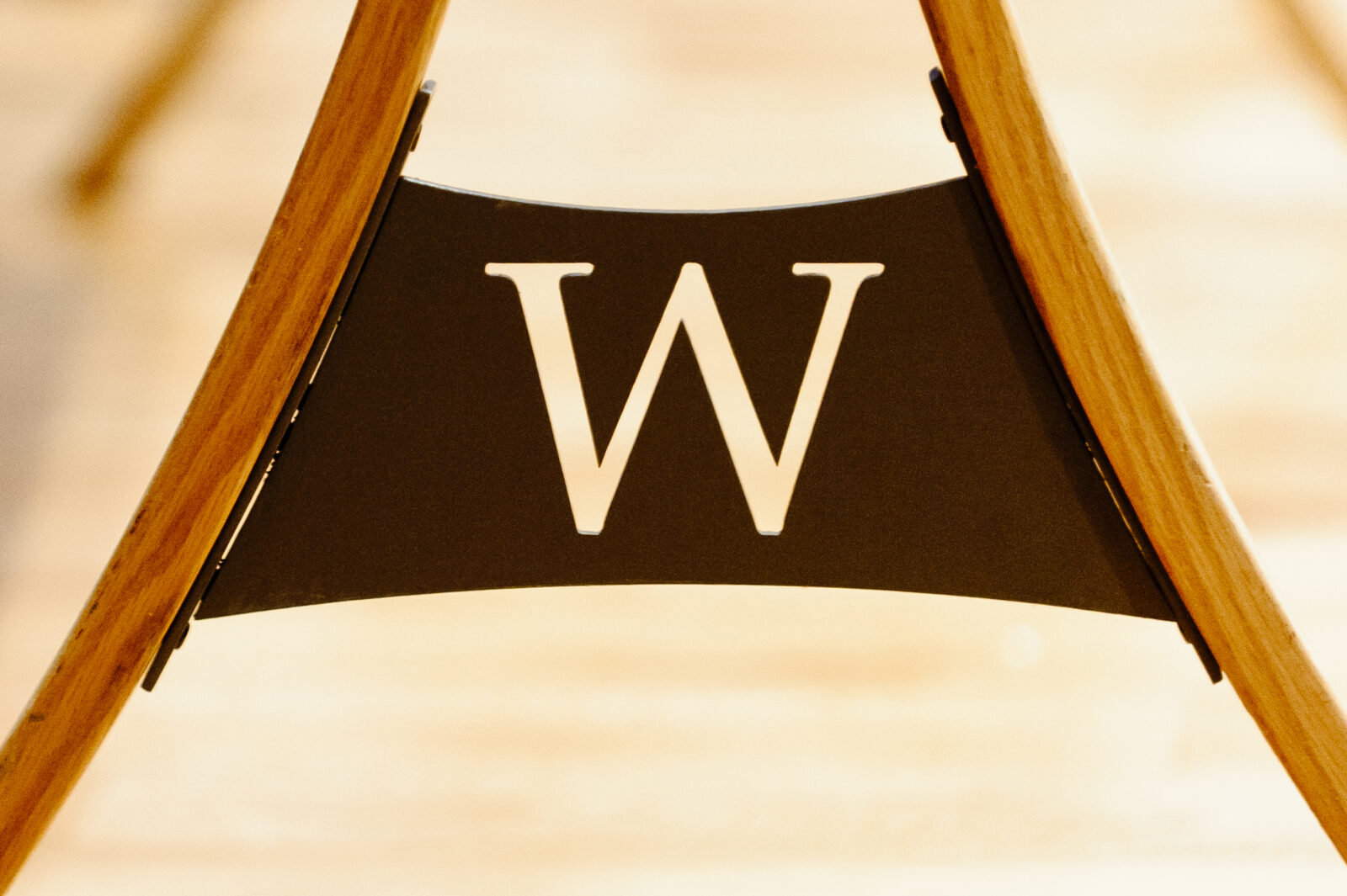An iconic W is seen on a portable easel