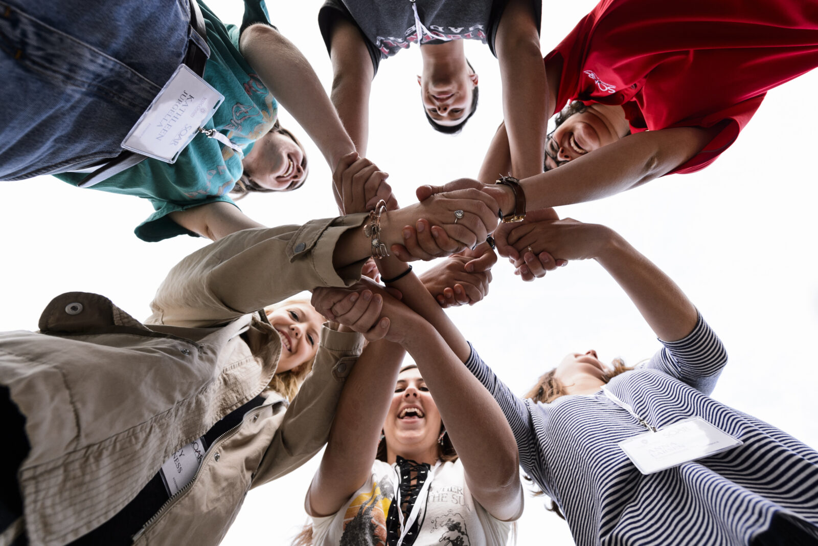 People form a “human knot” by holding hands